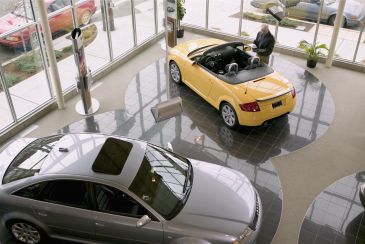Man Looking at an Audi Convertible