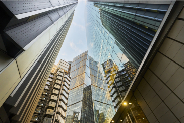 Low angle view looking directly up from Lime Street to Lloyds of London Building, The Scalpel Building and The Leadenhall Building in the City of London UK